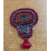 Broche rouge et perles de verre