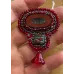 Broche rouge et perles de verre