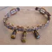 Collier ras de cou en macramé et 3 oeils de tigre Collier ras de cou en macramé et 3 oeils de tigre